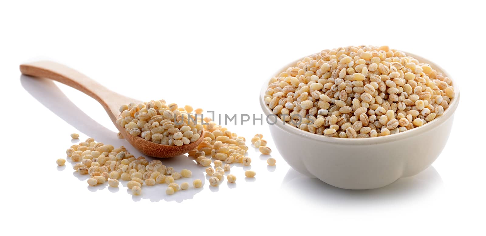 Job's tear seed in the white bowl on white background by sommai