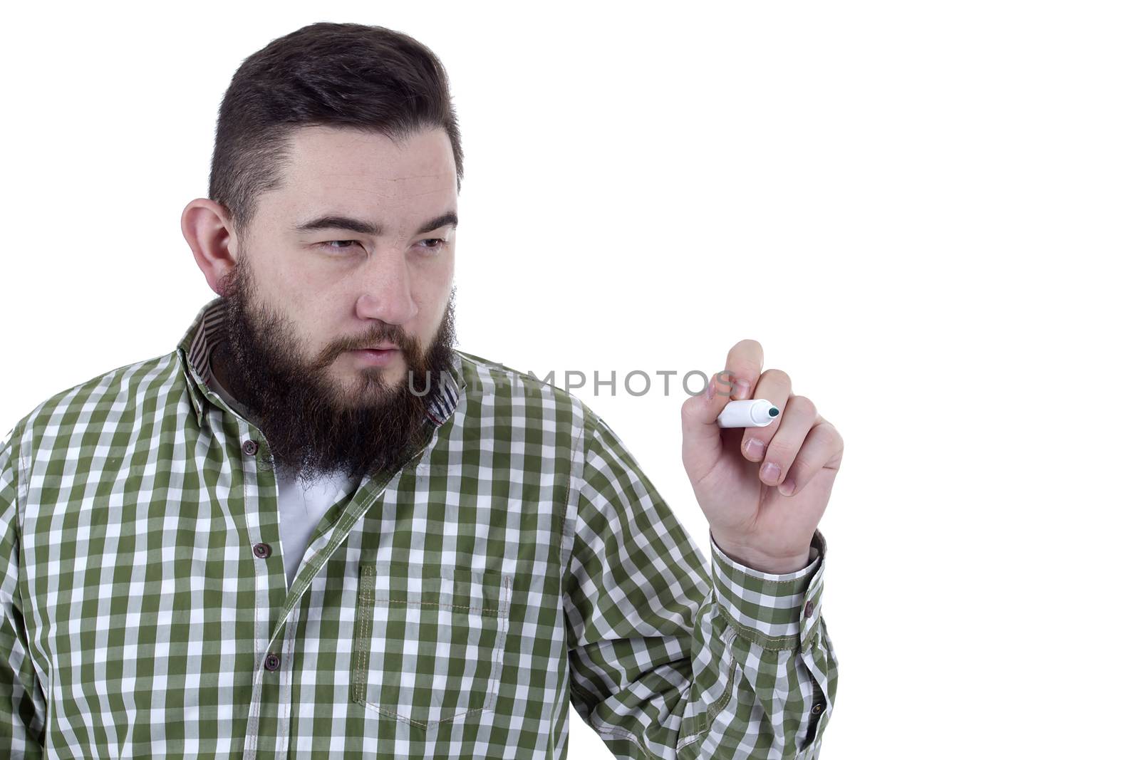 Man with a beard uses a green felt-tip pen on a white background