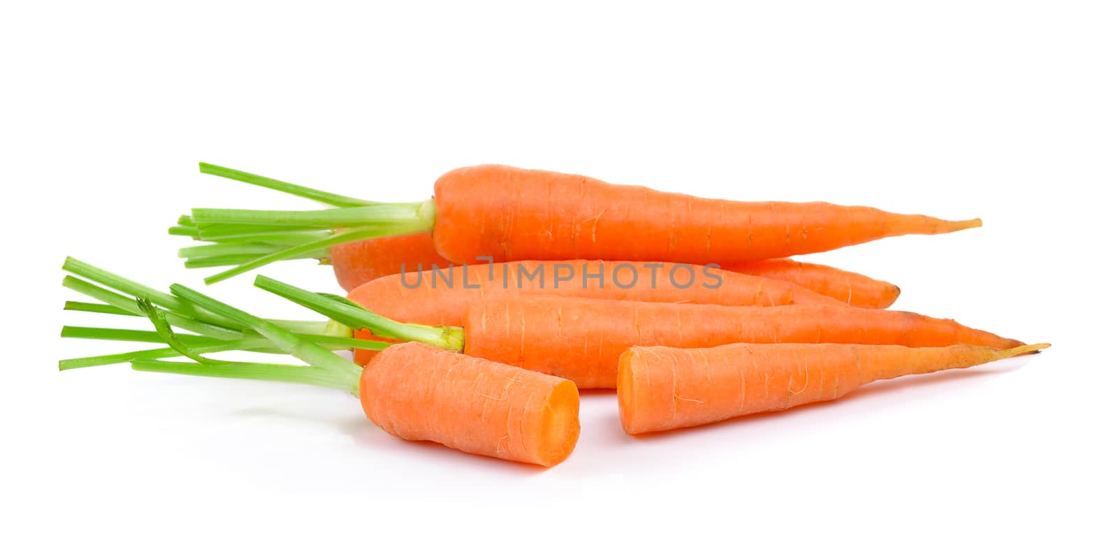  baby carrots on white background by sommai