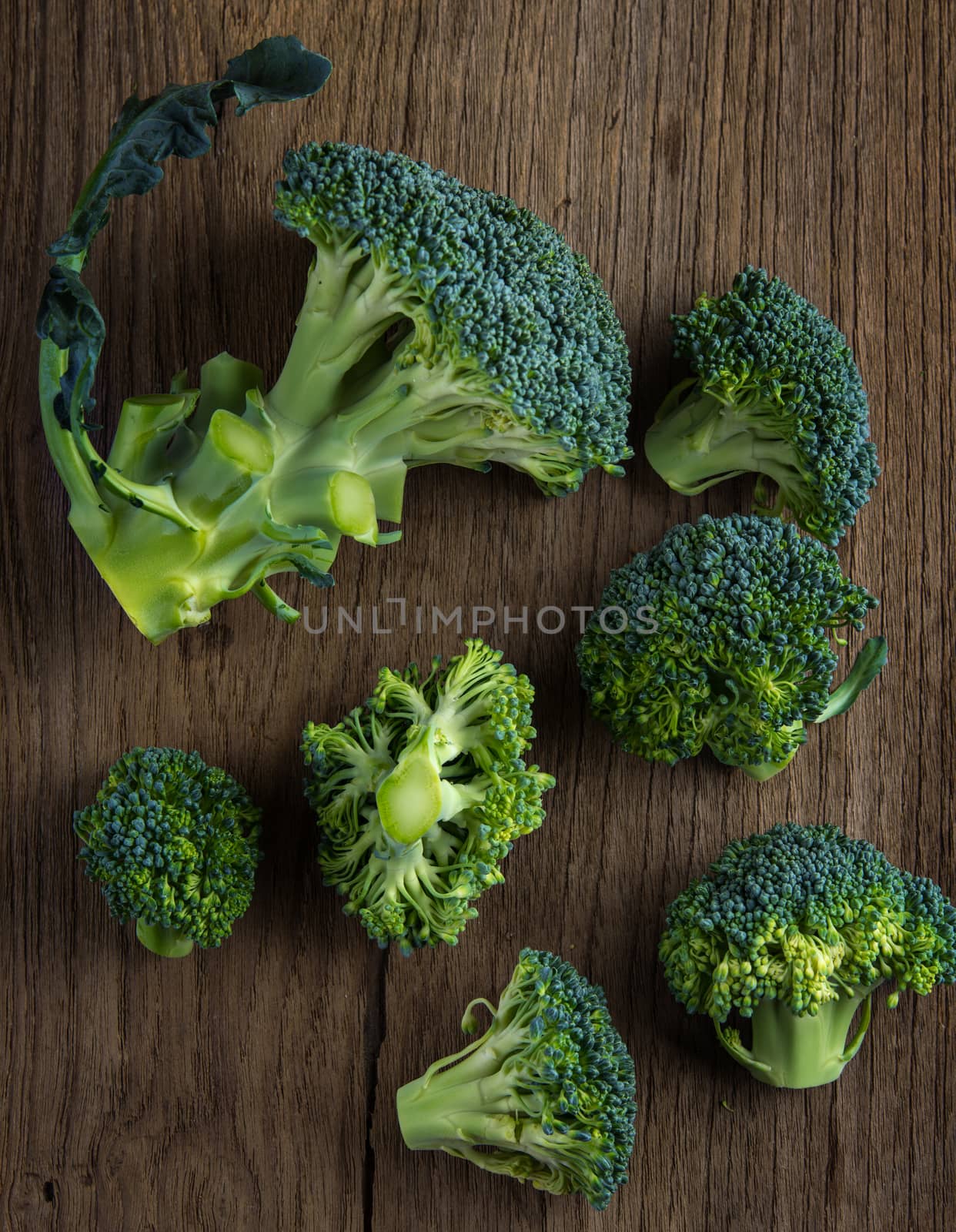 Broccoli on old wooden by sommai