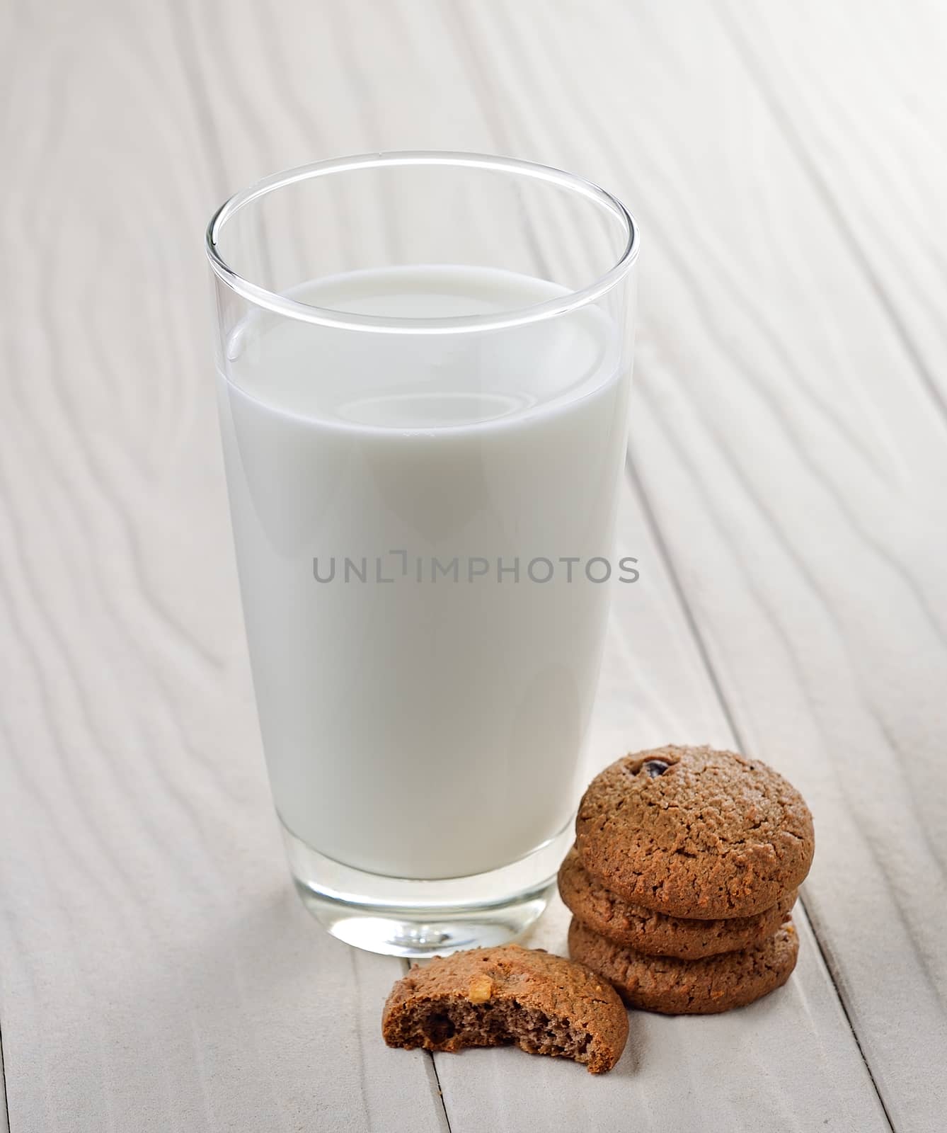 cookies and milk on a white wooden background