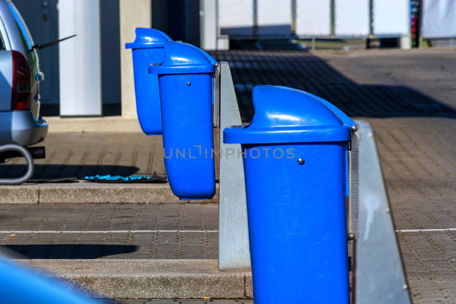 Trash can, waste container on a highway parking lot with resting place.