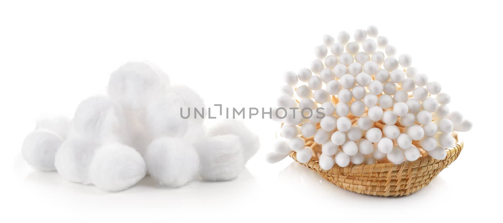 cotton bud and cotton wool in the basket on white background by sommai