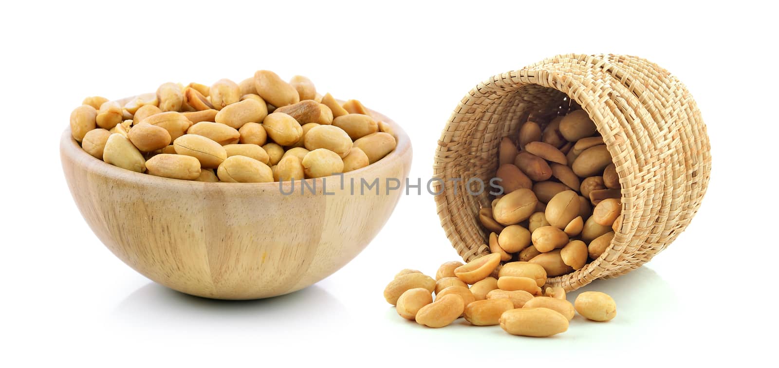 peanuts in the basket and wood bowl on white background