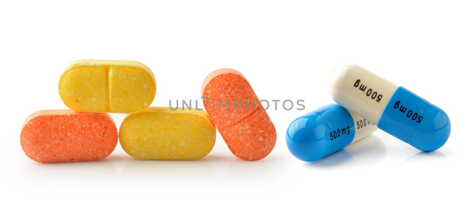 pills  capsules isolated on white background by sommai