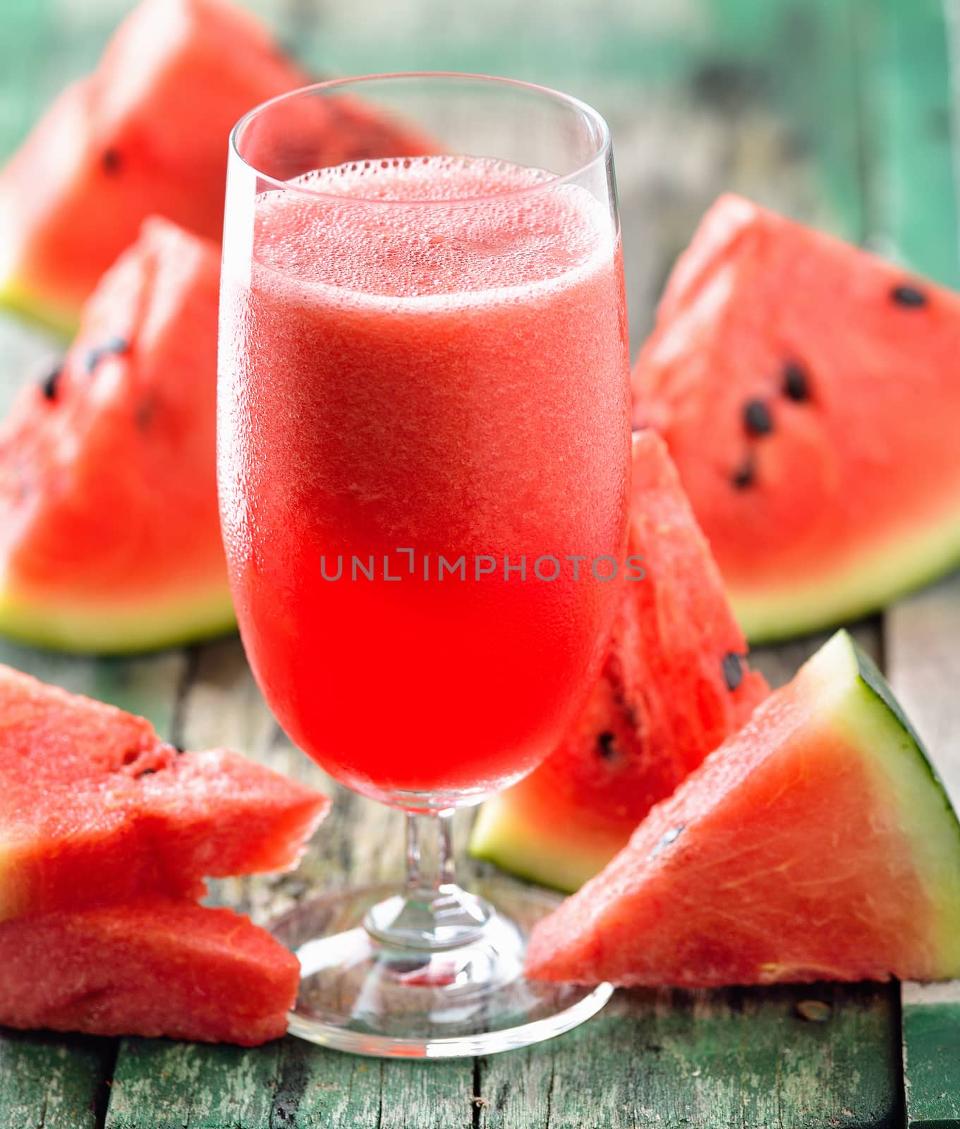 Watermelon drink in glasses with slices of watermelon by sommai