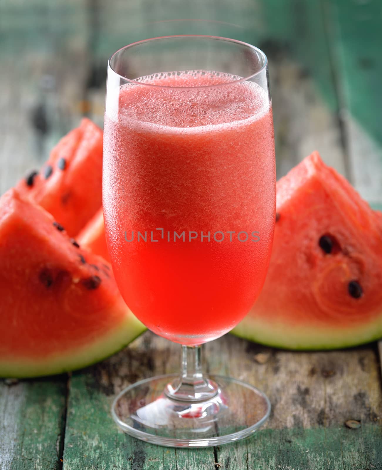 Watermelon drink in glasses with slices of watermelon by sommai