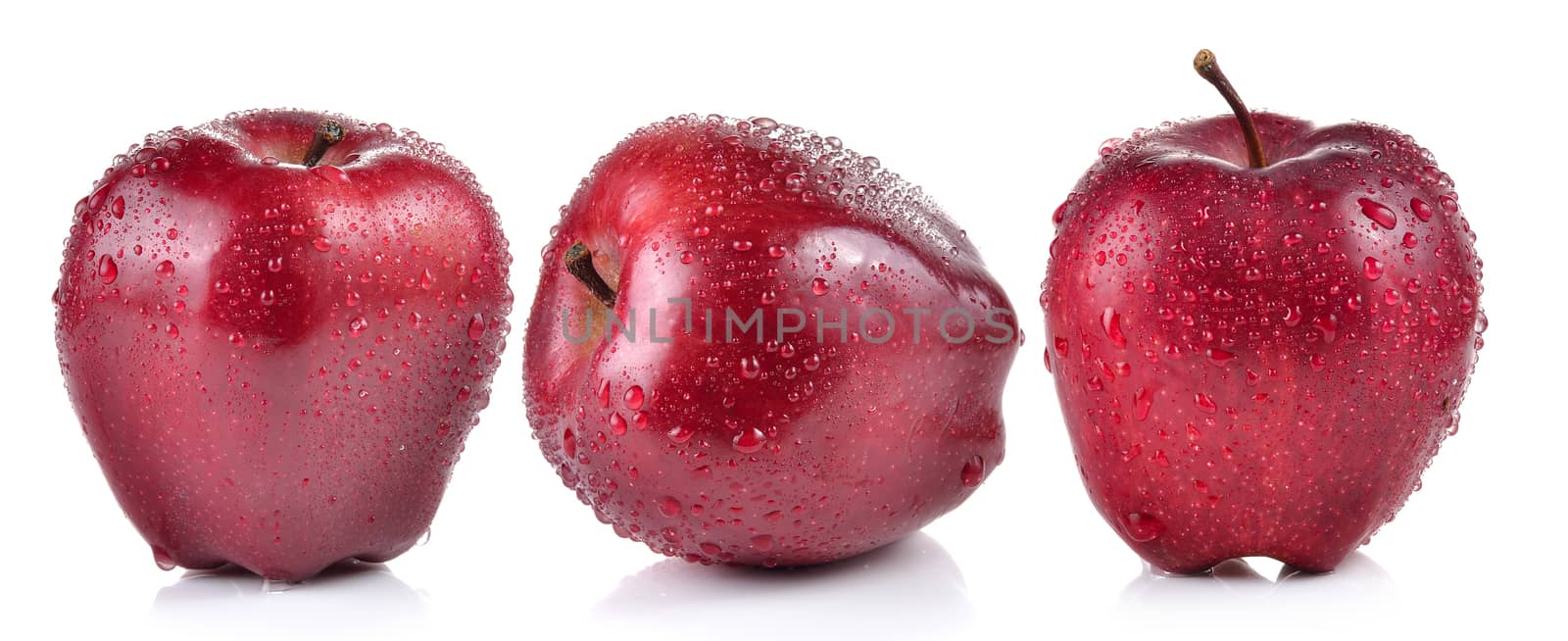 red apple with water drops on white background by sommai