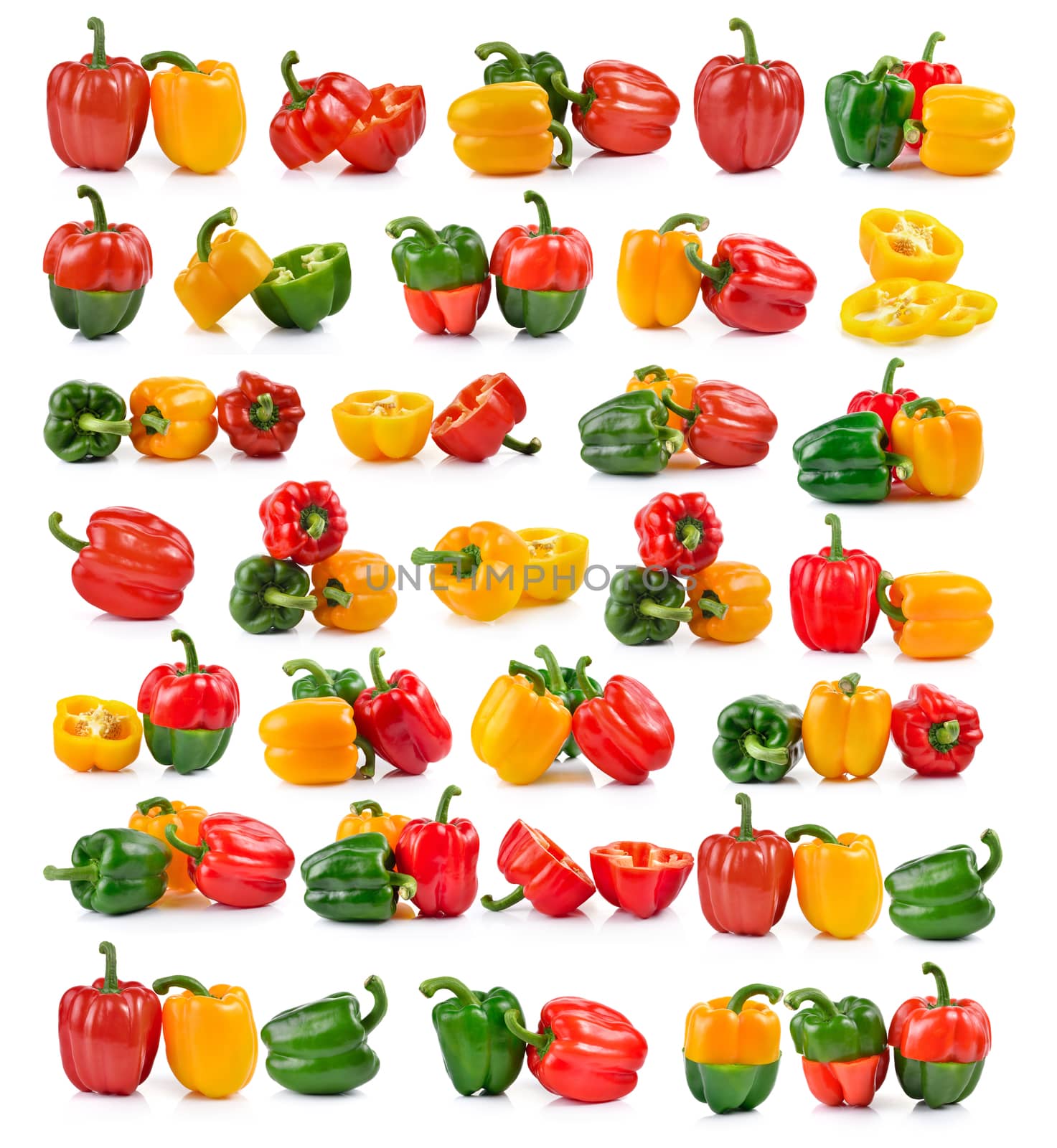 set of colored peppers over white background by sommai