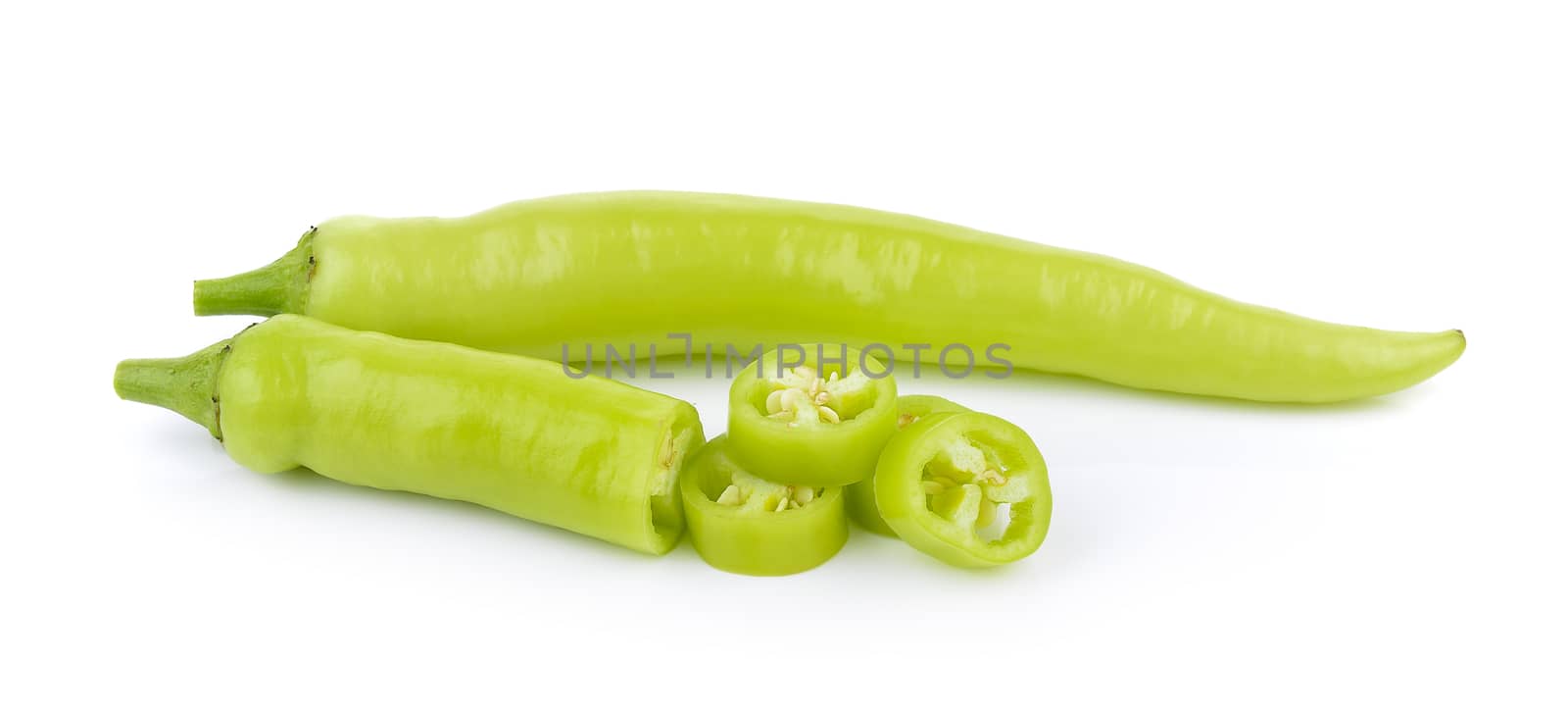 green chili pepper on white background by sommai