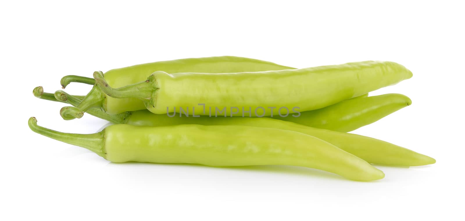 green chili pepper on white background by sommai