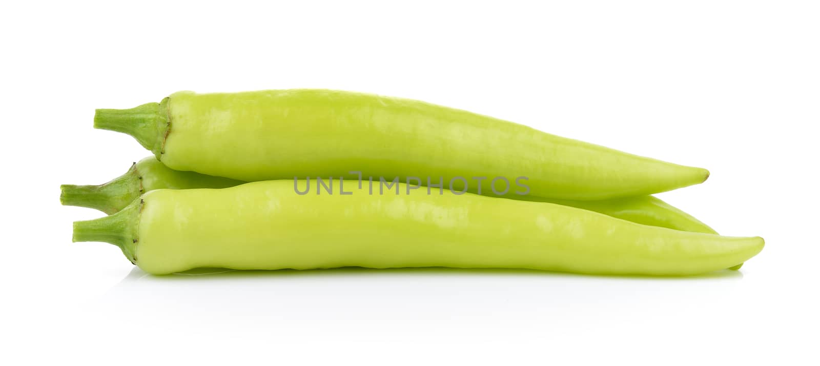 green chili pepper on white background by sommai