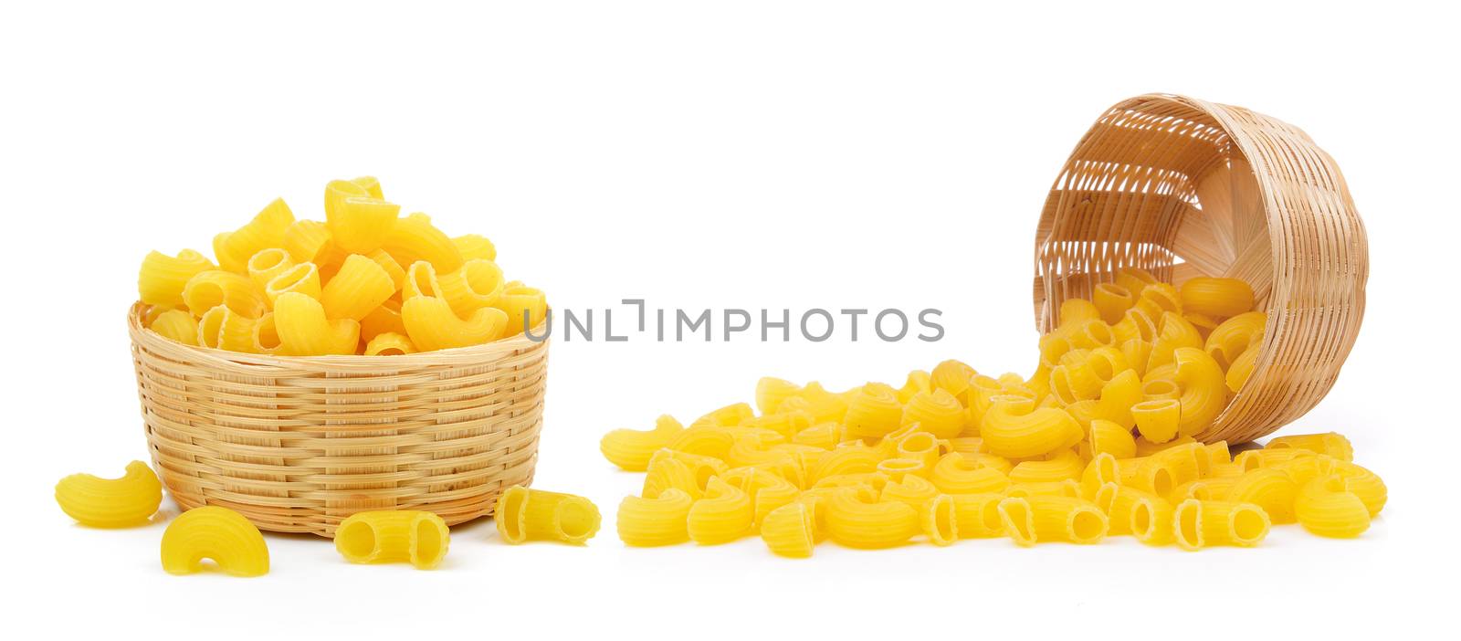 dry macaroni in the basket on white background by sommai