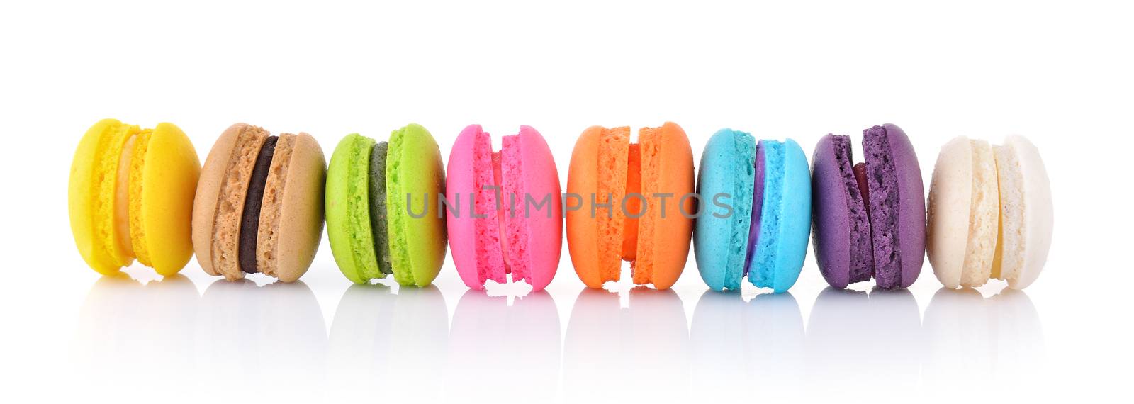 colourful french macaroons or macaron on white background by sommai