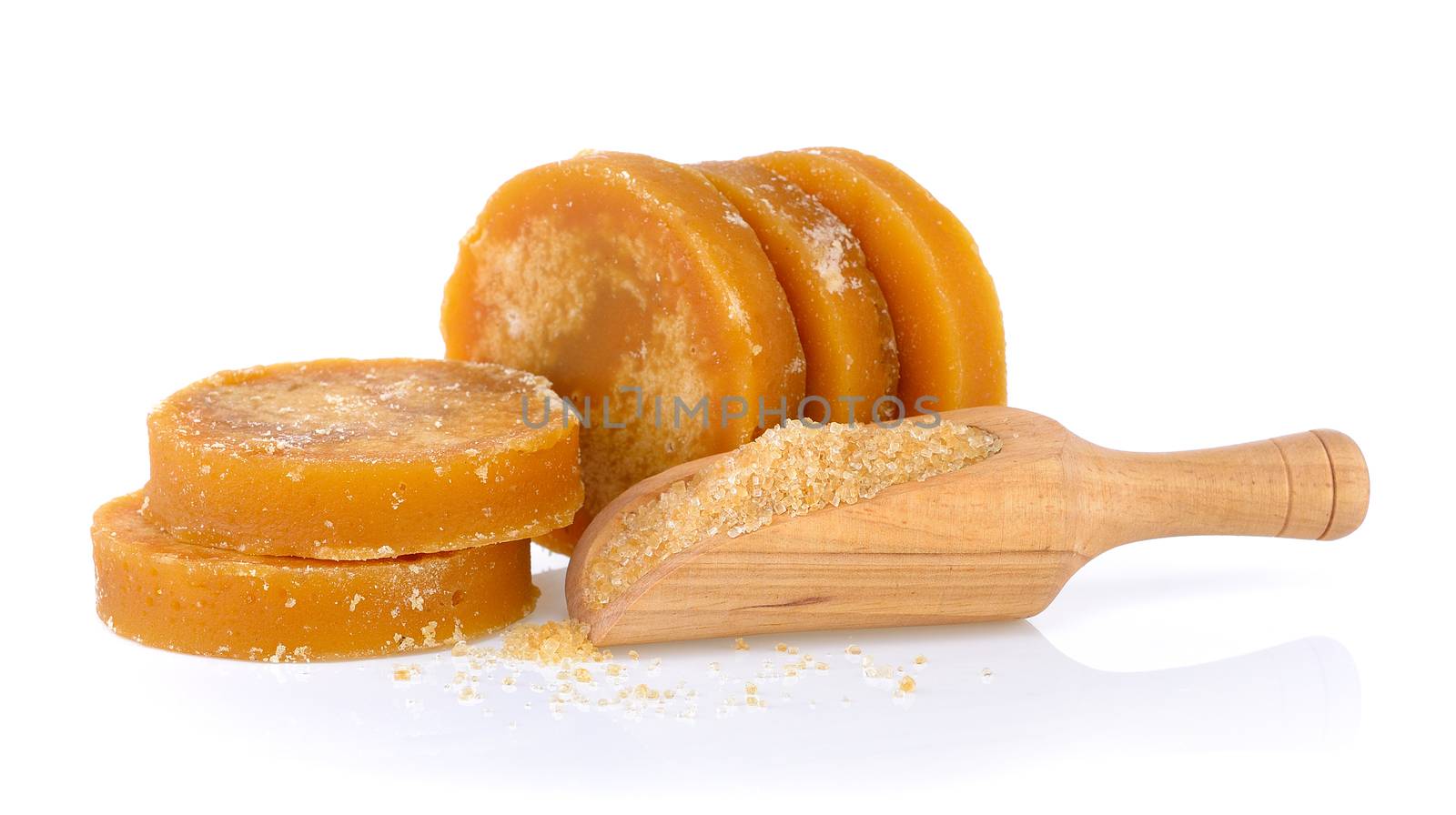 Sugarcane Hard Molasses or Jaggery and sugar in scoop on white b by sommai