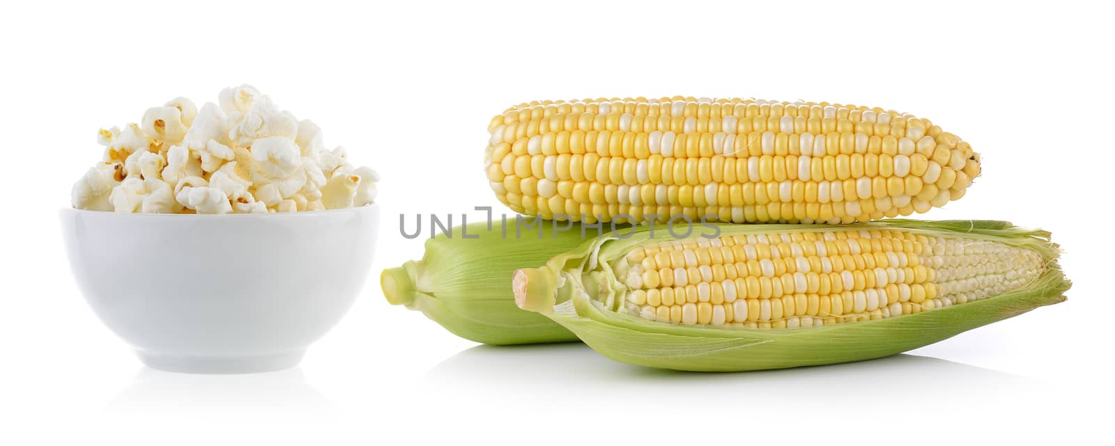 popcorn in bowl and corn isolated on white background by sommai