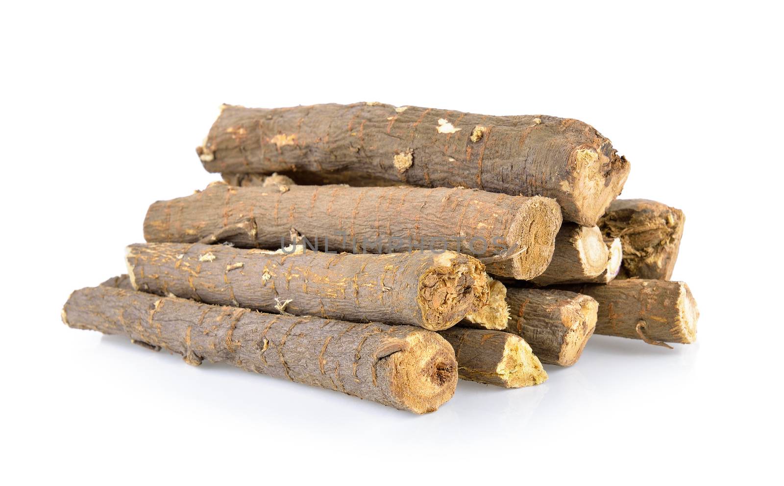 dried Liquorice roots isolated on white background by sommai