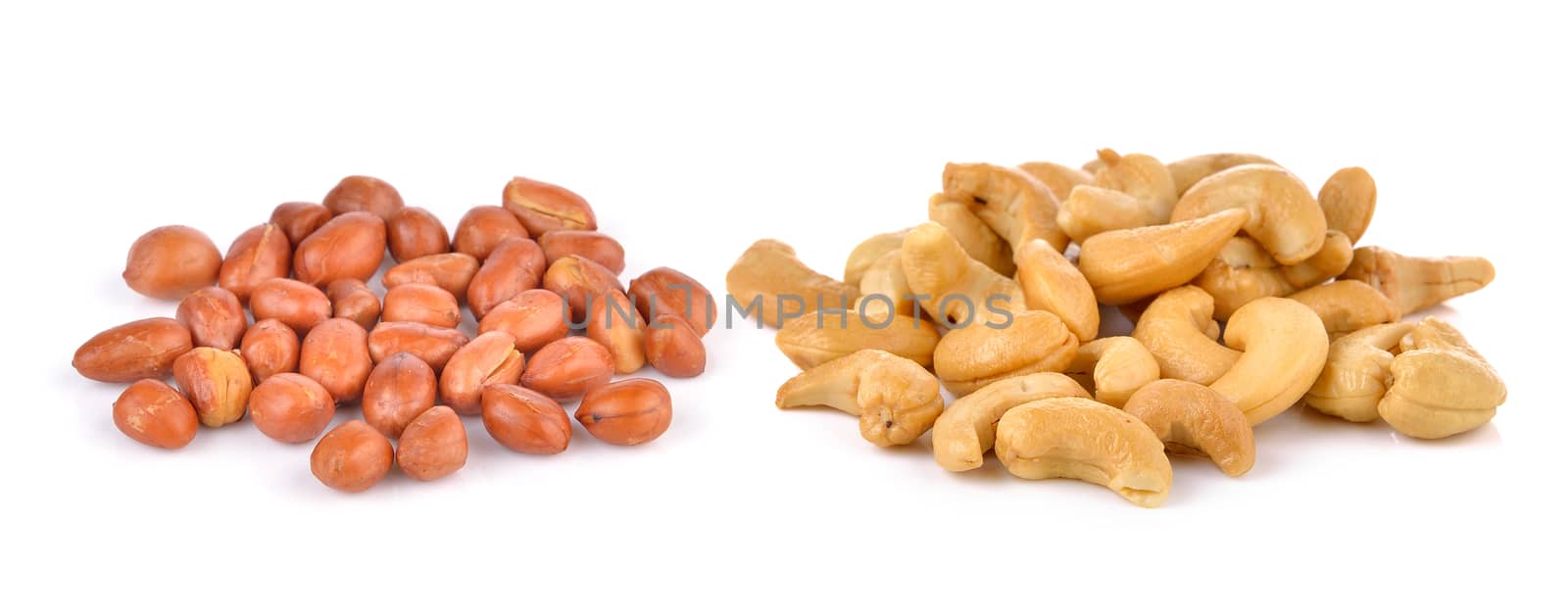 Cashews and peanats on white background  by sommai