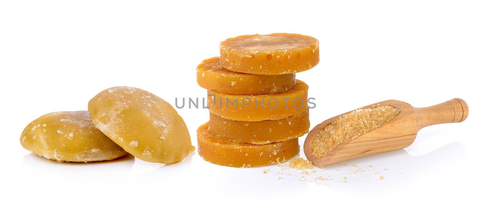 Sugarcane Hard Molasses or Jaggery and sugar in scoop by sommai