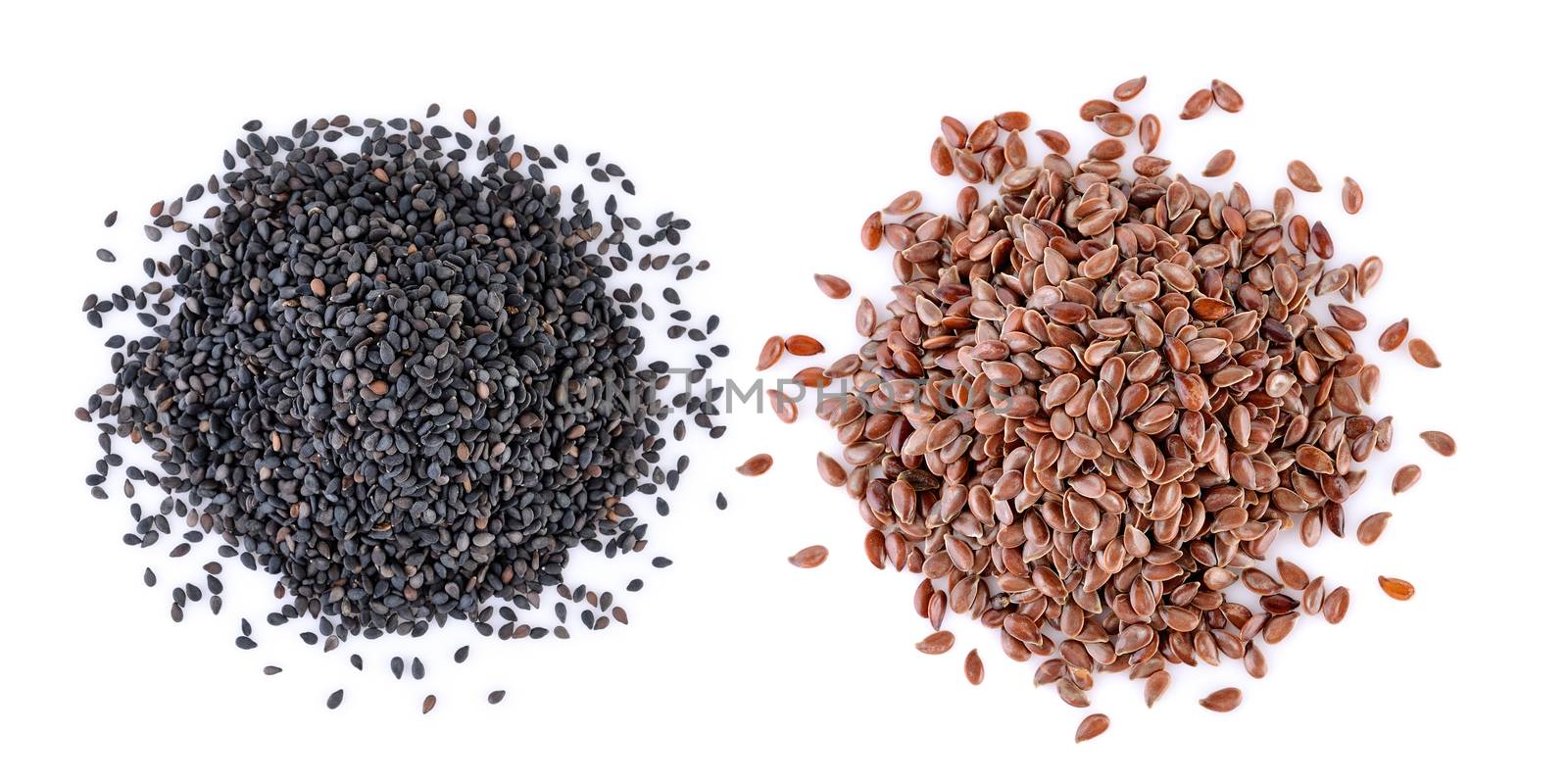 sesame and Flax seeds heap on white background by sommai