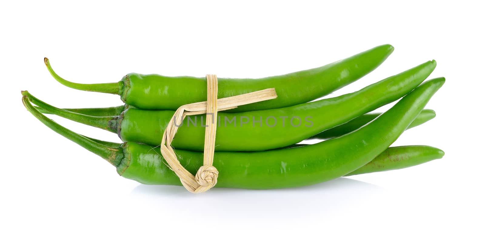 green chili pepper on white background by sommai