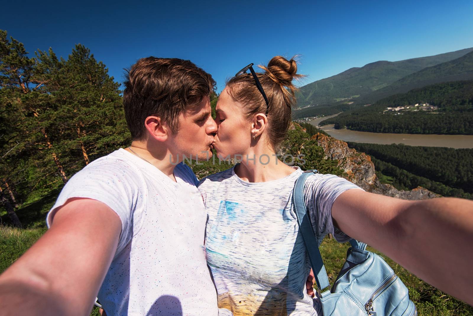 Kissing man and woman on top mountain by rusak