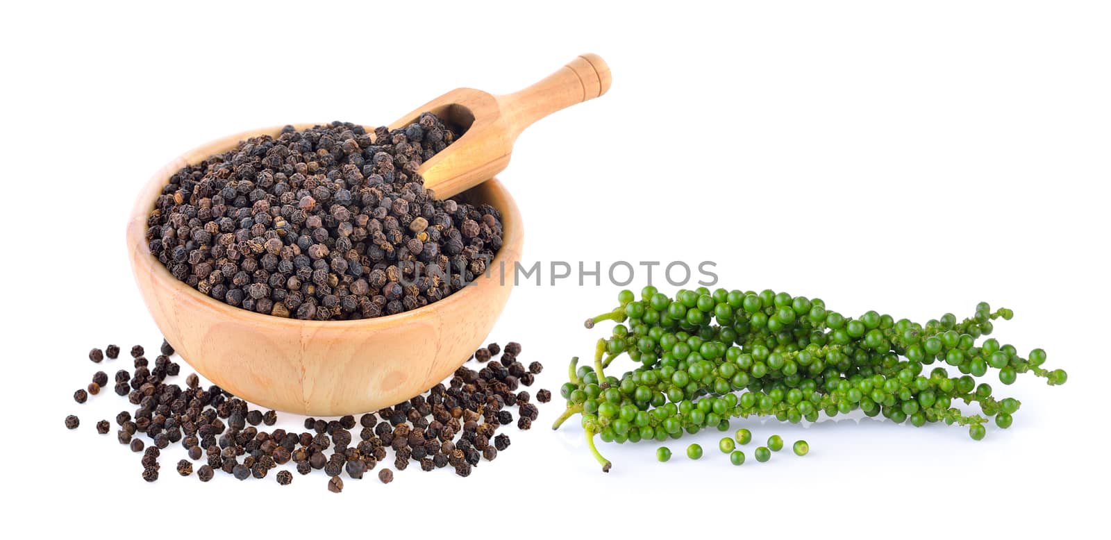 peppercorn in wood bowl with scoop by sommai