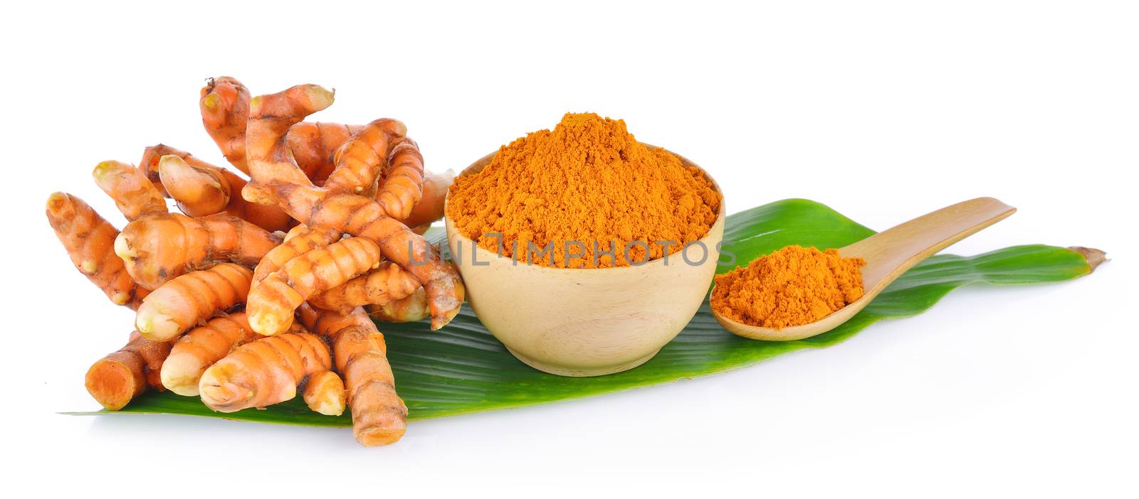 turmeric root and dry tumeric in wood bowl on white background by sommai