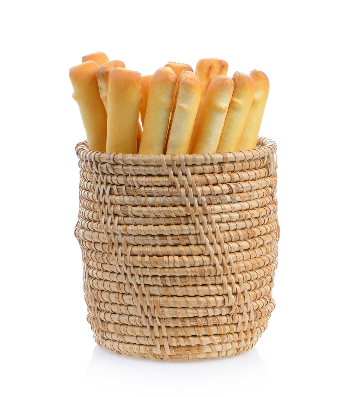bread sticks in basket isolated on white background by sommai