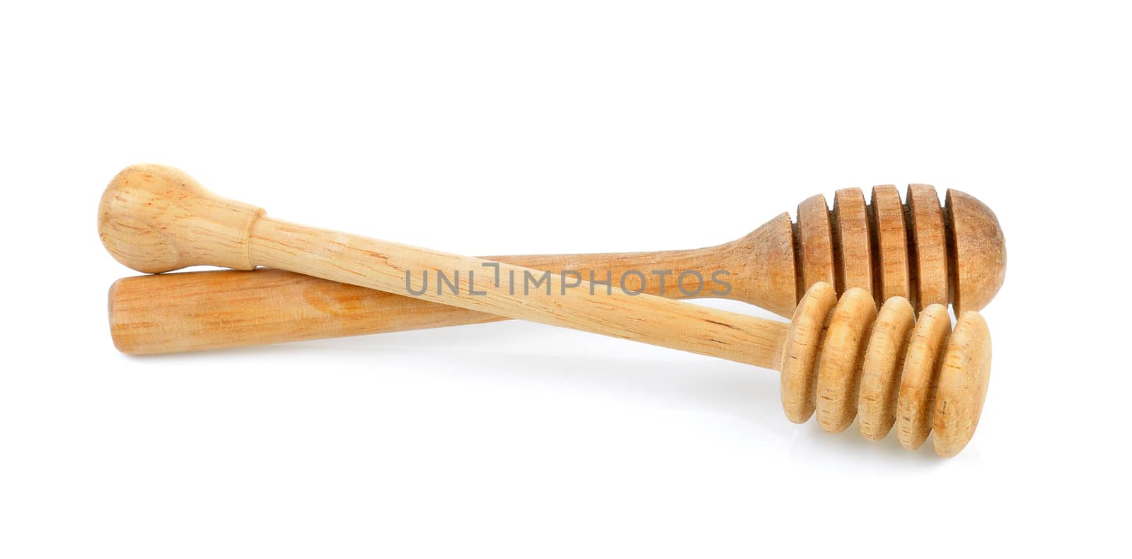 wooden honey stick isolated on white background