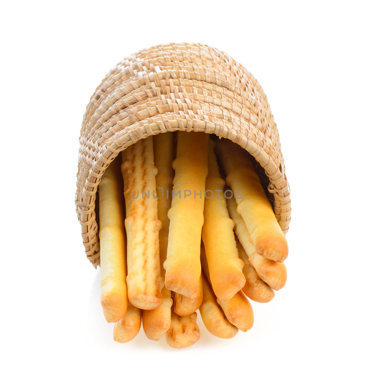 bread sticks in basket isolated on white background by sommai