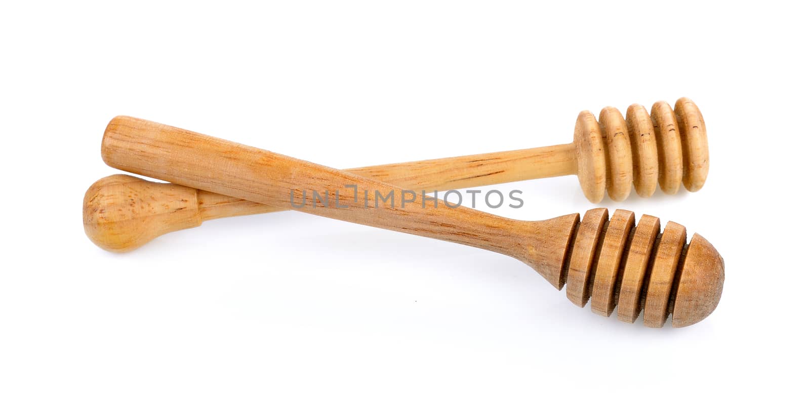 wooden honey stick isolated on white background by sommai