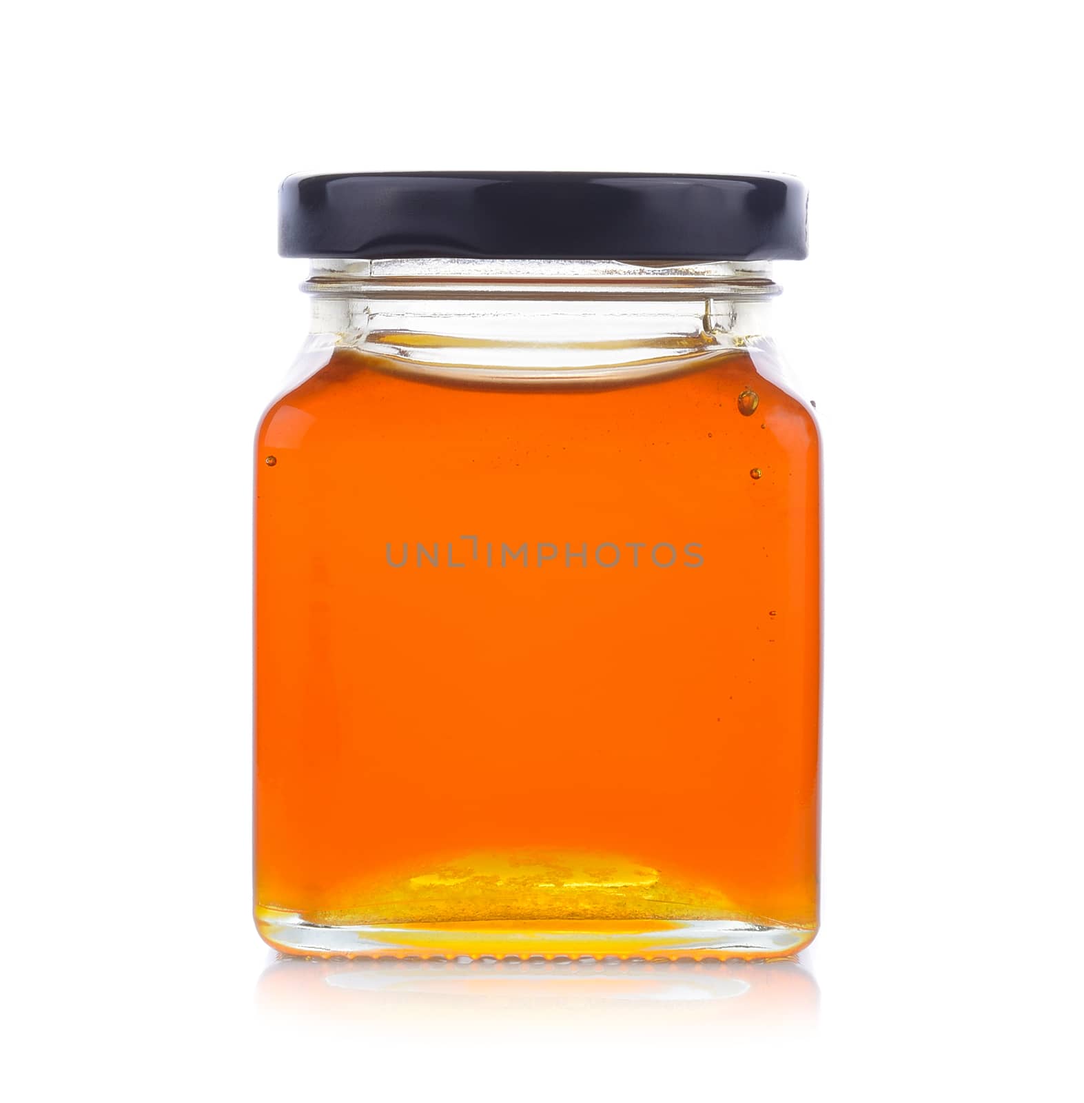 honey jar on white background by sommai