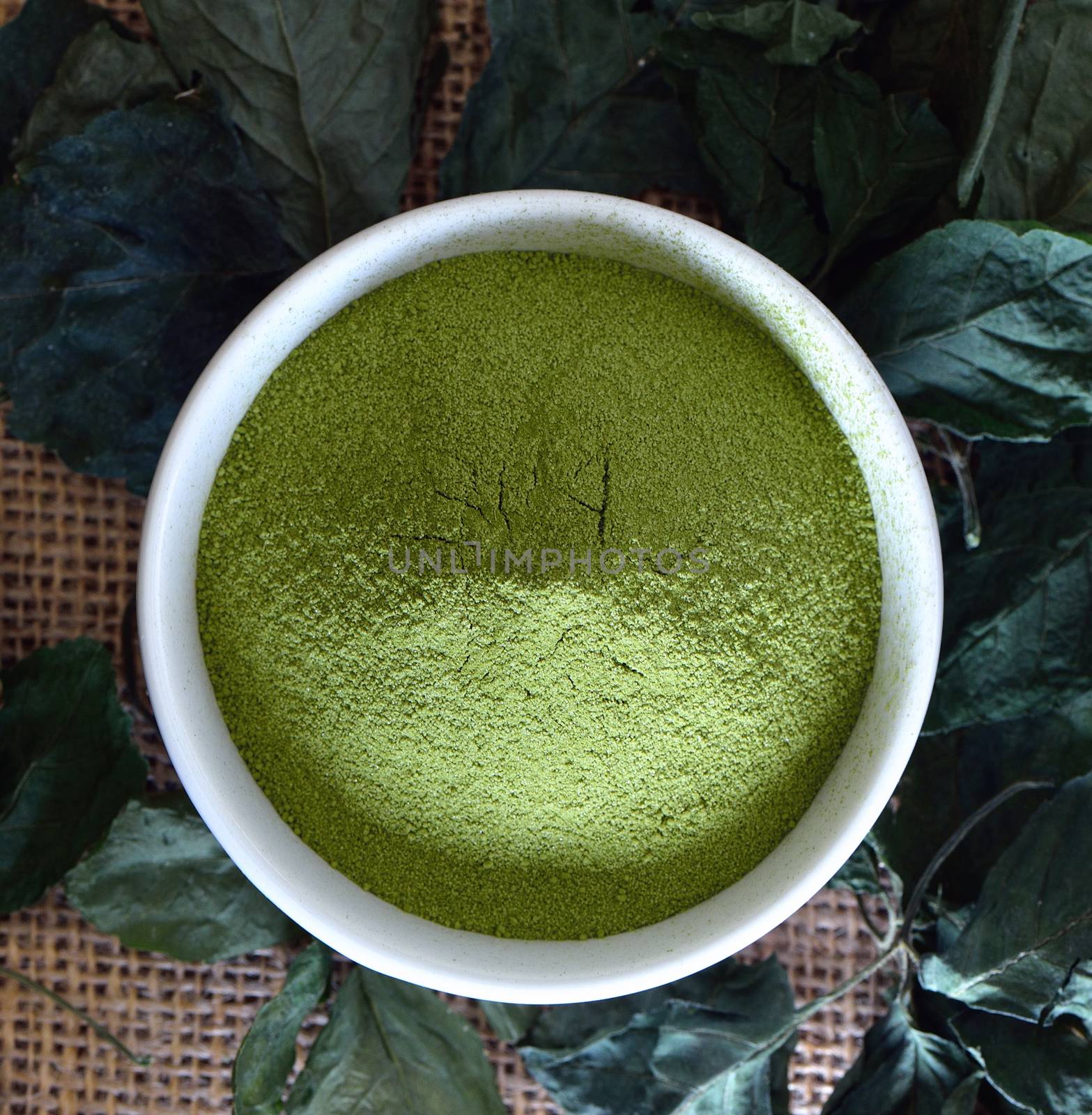 Green tea powder in cup  by sommai