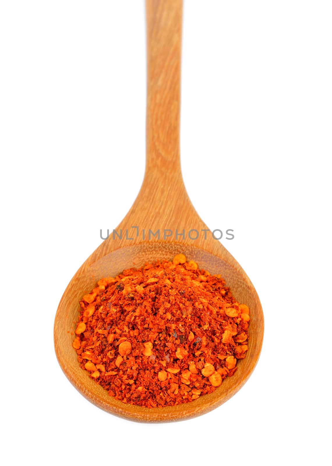 Cayenne pepper in wood spoon on white background by sommai