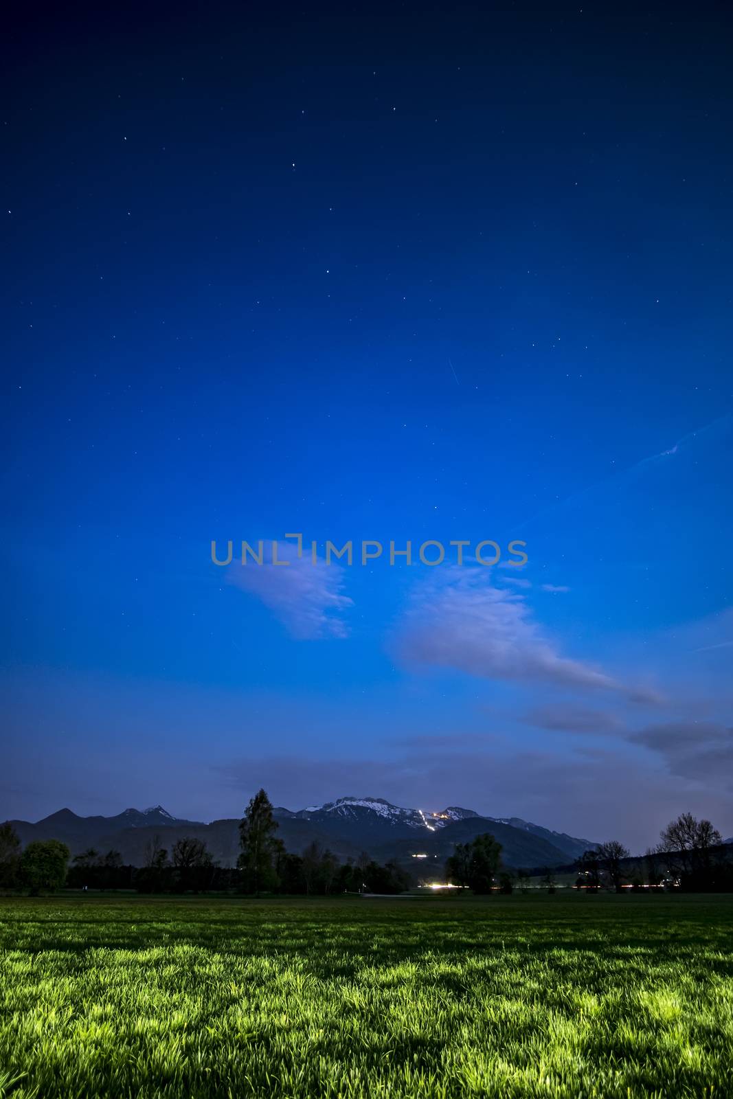 View to Kampenwand in Bavaria, Germany at night with stars