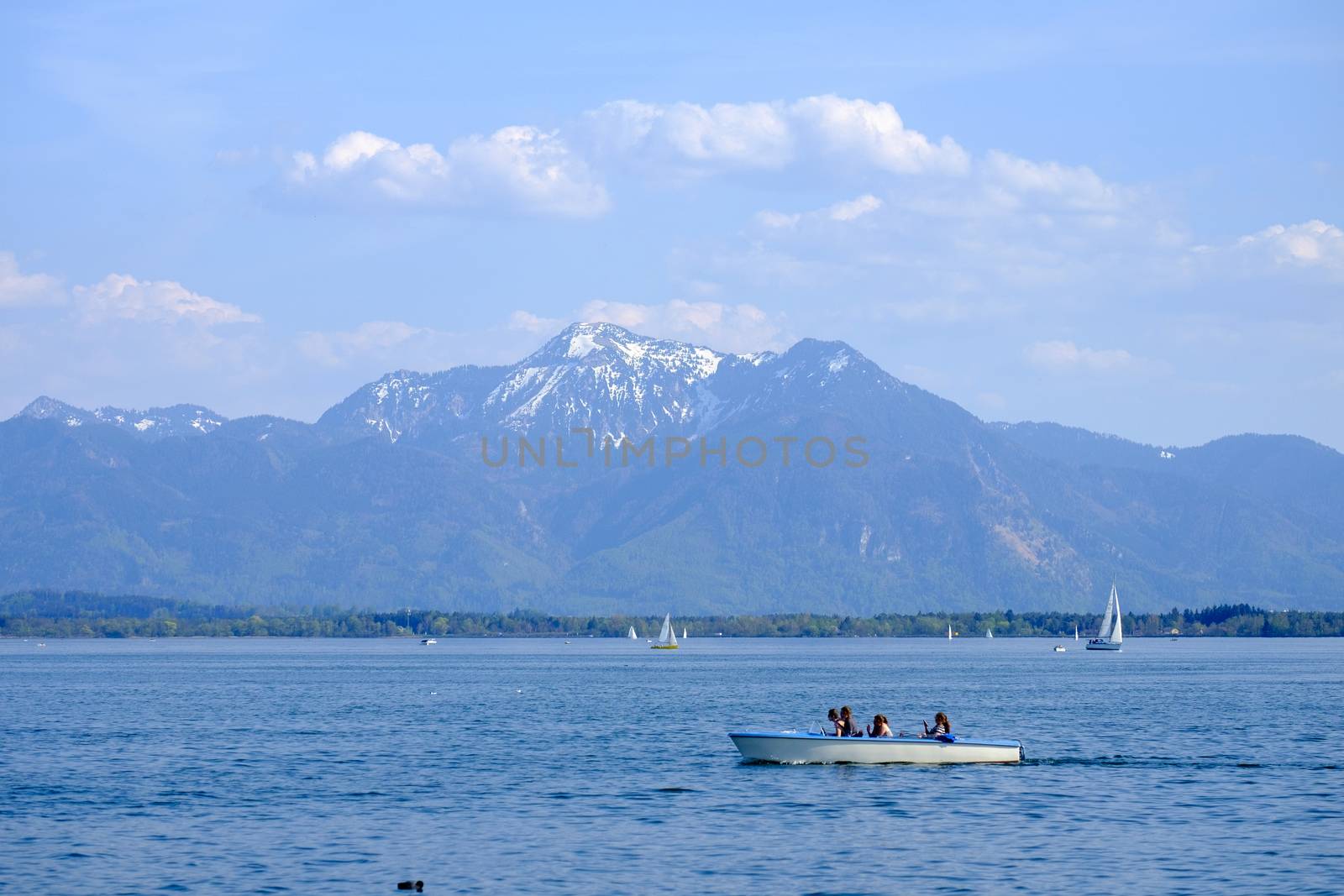 Landscape Chiemsee with boat in spring