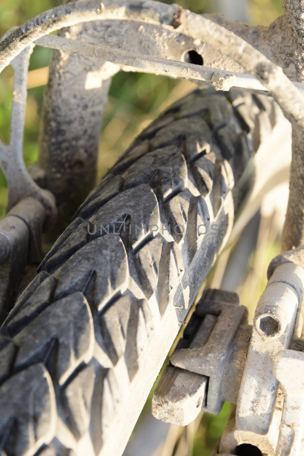 Close-up of bicycle tire with earth