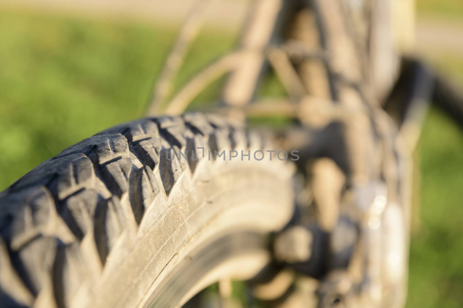 Close-up of bicycle tire with earth