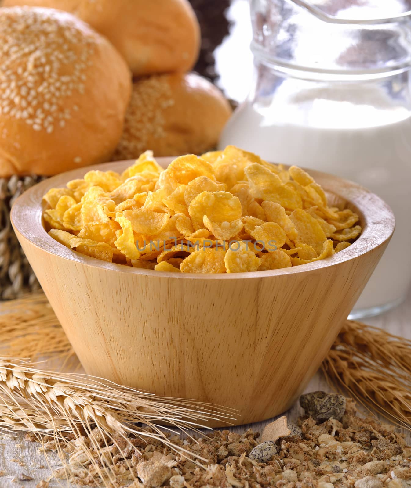 corn flakes in wood bowl  by sommai