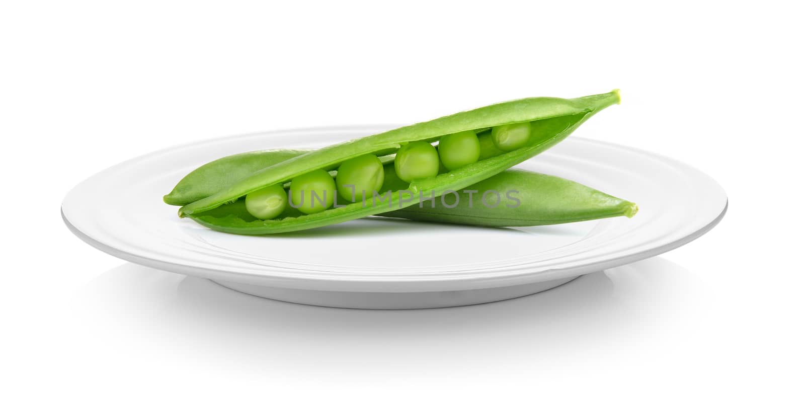 sweet peas in plate on white background by sommai