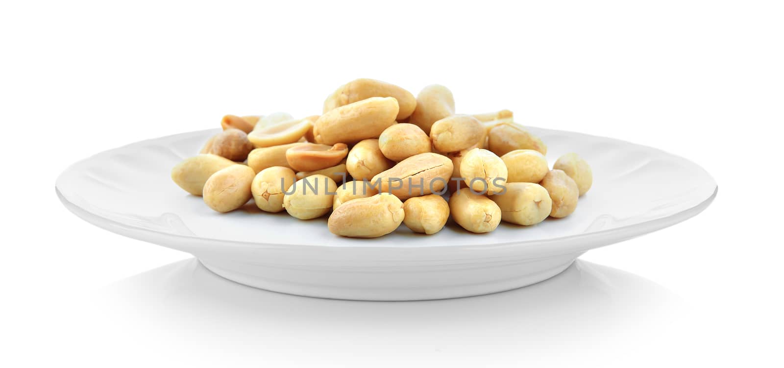 peanuts in white plate on white background by sommai