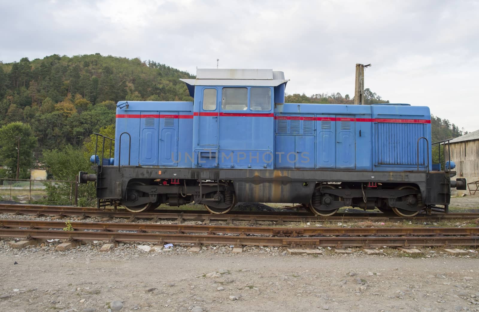 Old diesel railroad locomotive in depot