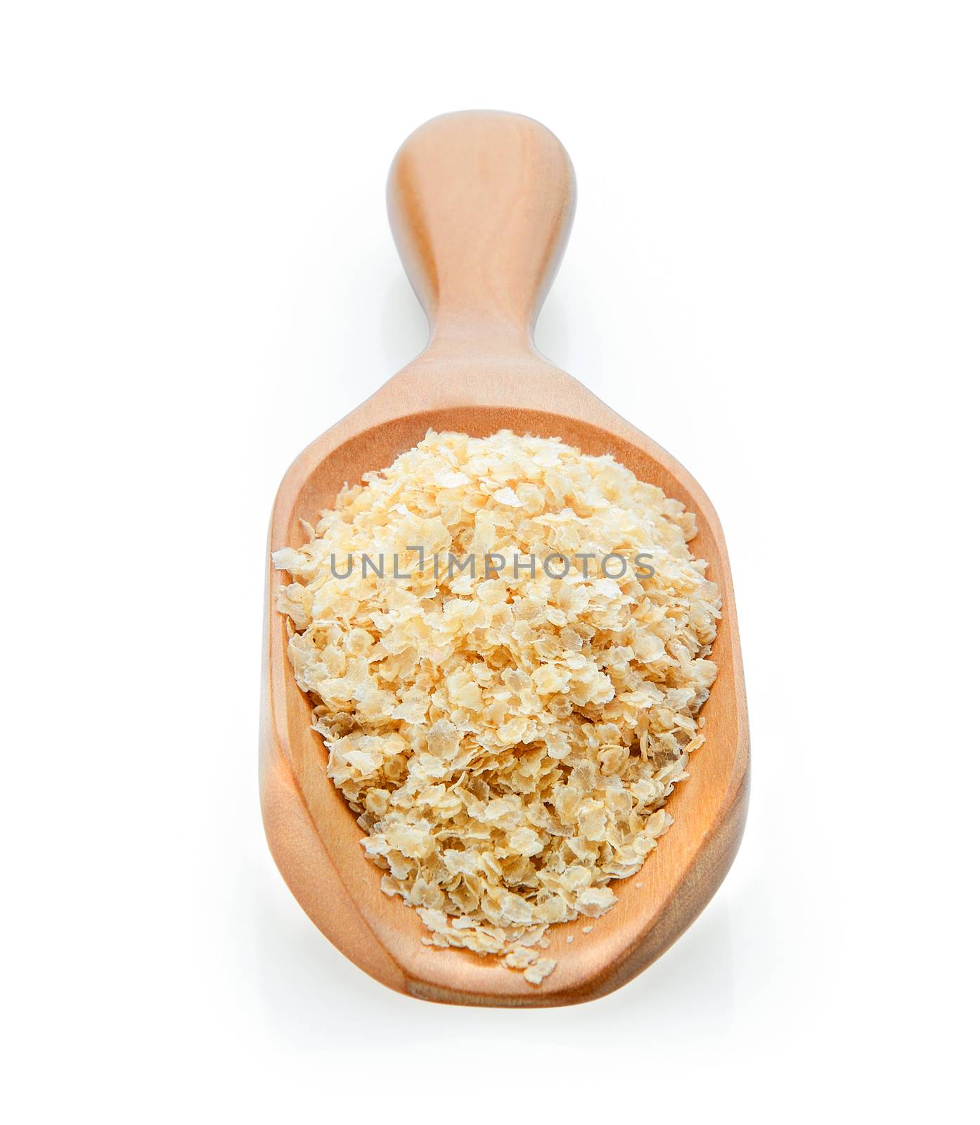 amaranth seeds on wooden scoop over white background