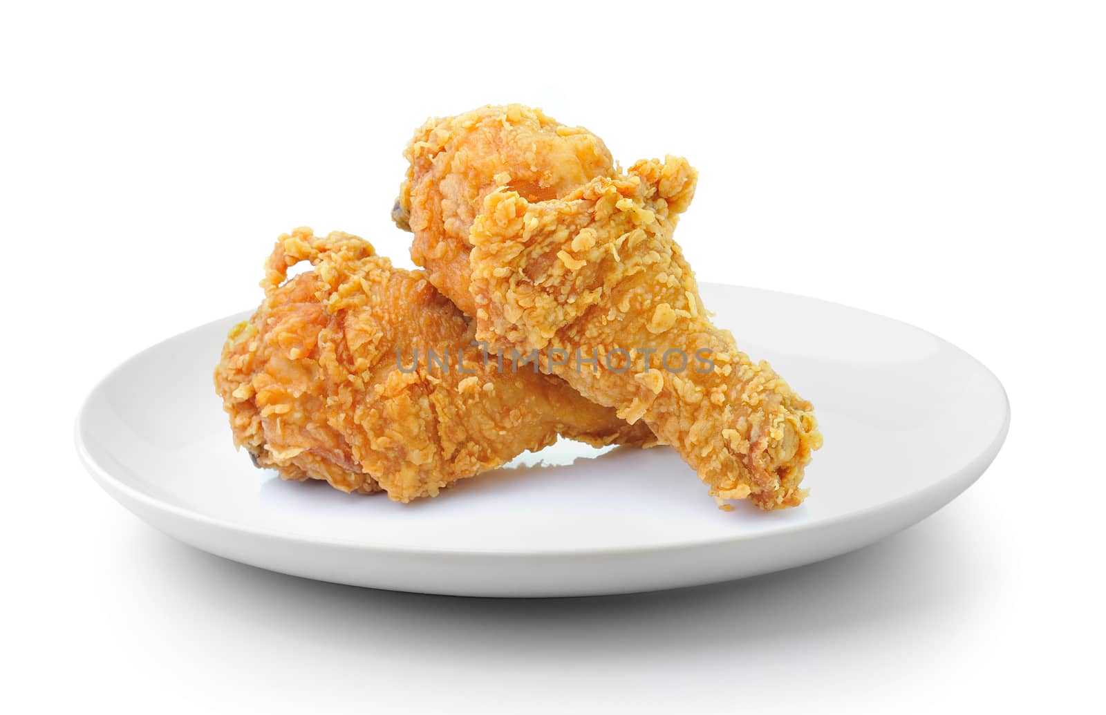 fried chicken drumsticks in plate isolated on a white background