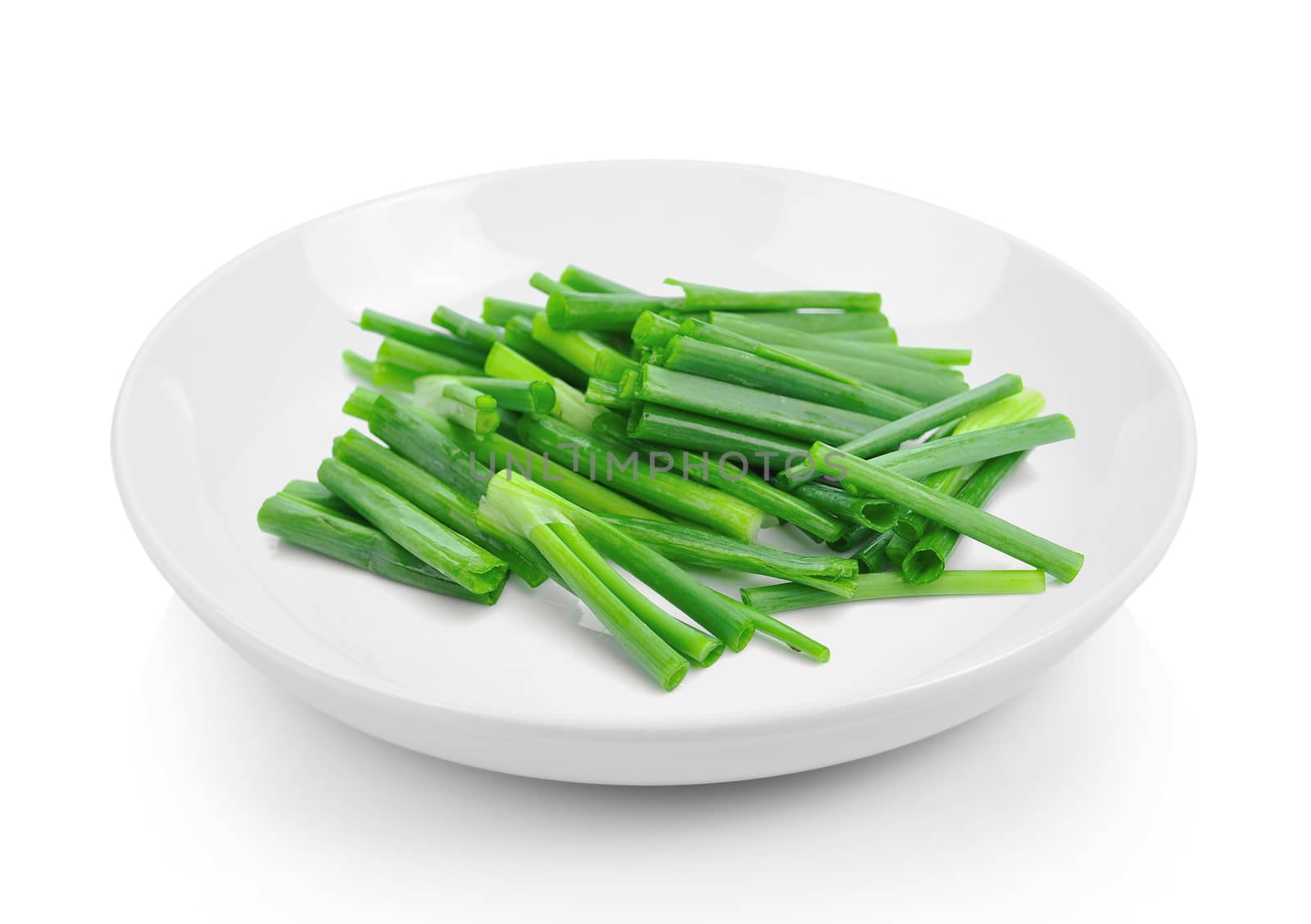 onions in plate on white background