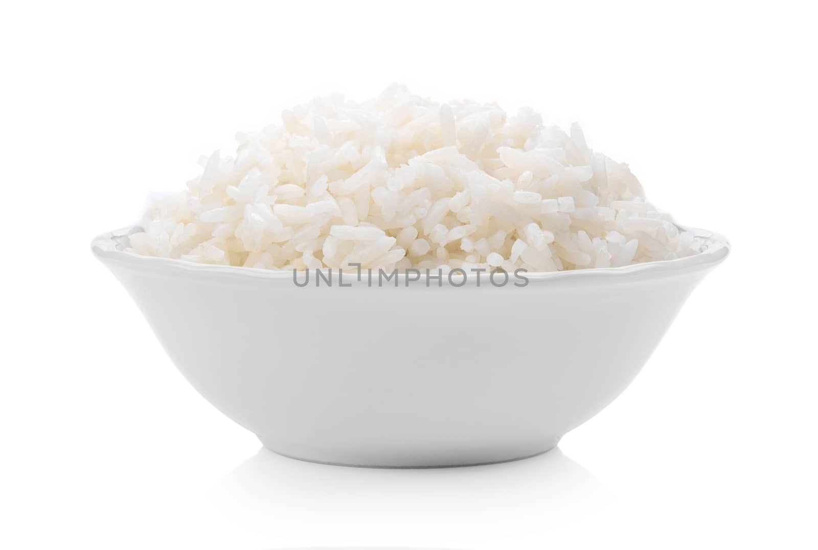 Cooked rice in ceramic bowl on white background