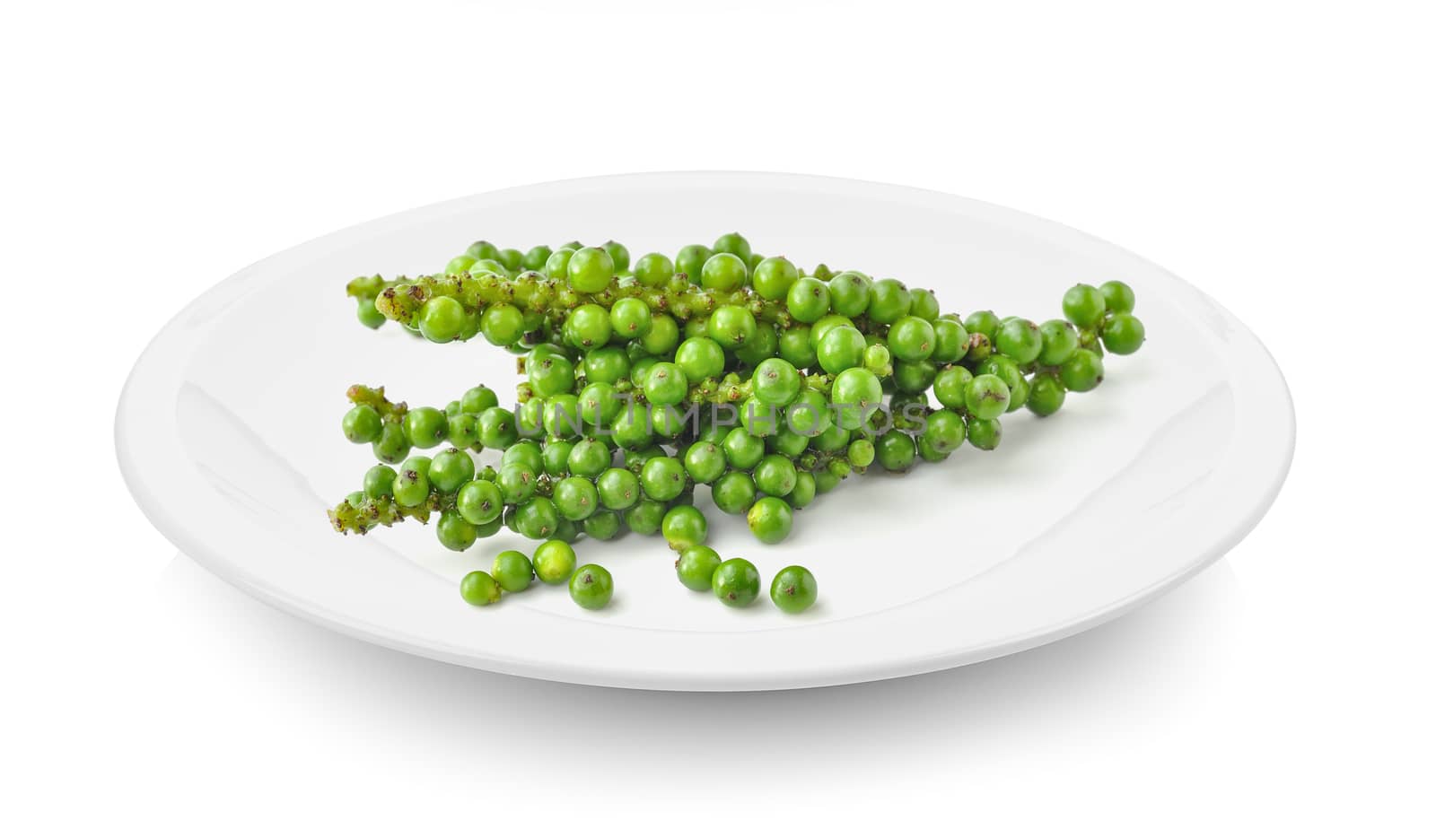 green pepper corn in plate on white background