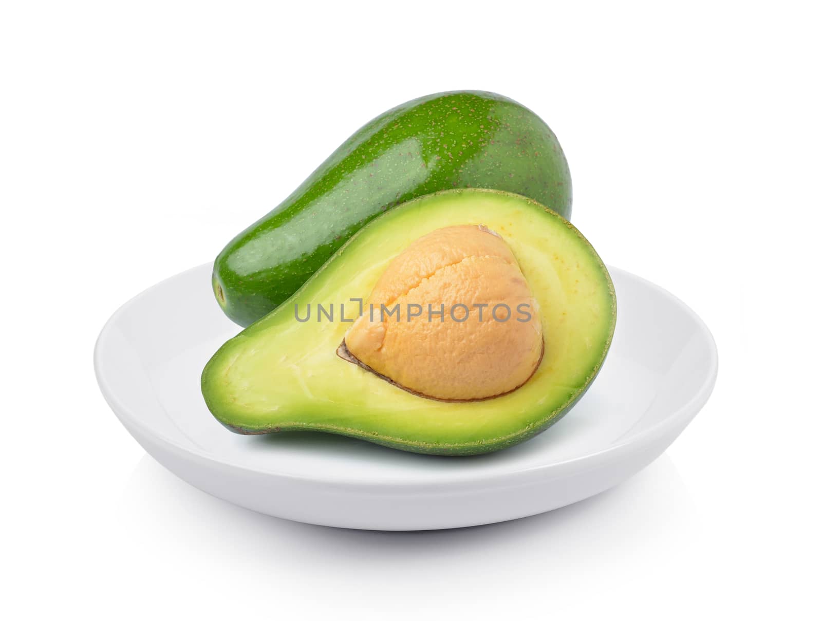 avocado in plate on white background