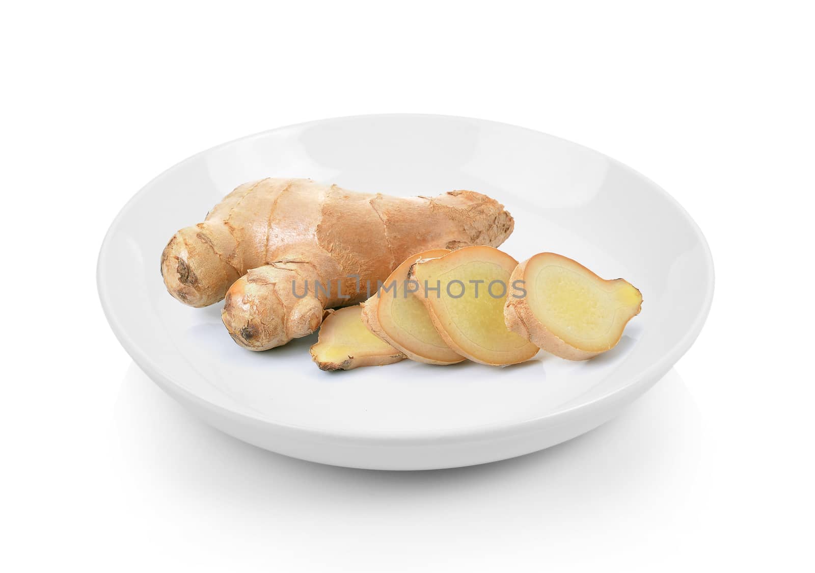 ginger in plate on white background